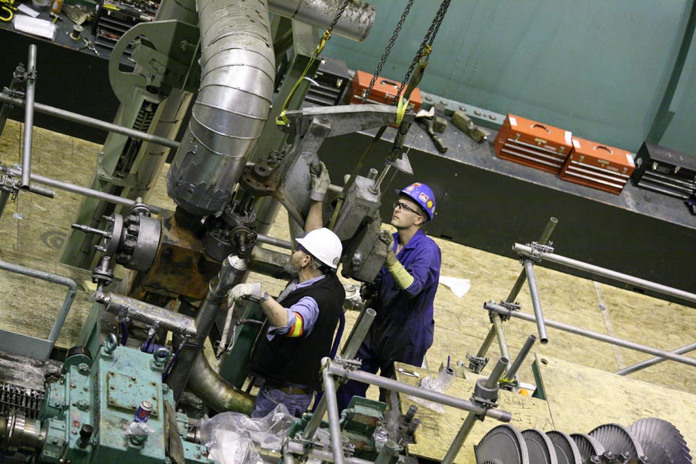 Heavy industrial plant with welder at work